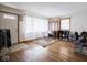 Bright living room featuring hardwood floors, front door access and large window for plenty of natural light at 3538 Whalen Ave, Indianapolis, IN 46227