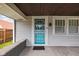 Covered front porch with storm door and brick base and pillar features at 3916 E 10Th St, Indianapolis, IN 46201