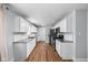 Modern kitchen featuring white cabinets, granite countertops, and stainless steel appliances at 3916 E 10Th St, Indianapolis, IN 46201