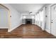 Living room boasts hardwood floors, a decorative fireplace, and ample natural light from large windows at 3916 E 10Th St, Indianapolis, IN 46201