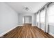 Spacious living room with beautiful wood flooring, updated trim and ample natural light at 3916 E 10Th St, Indianapolis, IN 46201
