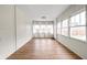 Cozy sunroom with wood floors, lots of windows and natural light at 3916 E 10Th St, Indianapolis, IN 46201
