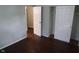 Bedroom featuring hardwood floors, reach-in closet and natural light at 4353 Evanston Ave, Indianapolis, IN 46205
