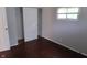 Bedroom featuring hardwood floors, sliding door closet and natural light at 4353 Evanston Ave, Indianapolis, IN 46205