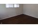 Bedroom features hardwood floors and natural light from two windows at 4353 Evanston Ave, Indianapolis, IN 46205