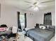 Simple bedroom featuring a comfortable bed, soft lighting, and minimalist decor, creating a cozy and serene space at 4415 N Longworth Ave, Indianapolis, IN 46226
