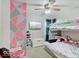 Shared bedroom showcasing a bunk bed setup, playful decor, and a colorful accent wall, ideal for children at 4415 N Longworth Ave, Indianapolis, IN 46226