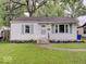 Charming home featuring a well-maintained lawn and lovely landscaping at 4415 N Longworth Ave, Indianapolis, IN 46226