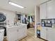 Modern kitchen with stainless steel appliances, stone countertops, and an open layout at 4415 N Longworth Ave, Indianapolis, IN 46226