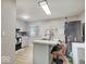 Modern kitchen with stone countertops, stainless steel appliances, and an island with seating at 4415 N Longworth Ave, Indianapolis, IN 46226