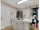 Well-lit kitchen with a modern sink, island with seating, and stainless steel appliances at 4415 N Longworth Ave, Indianapolis, IN 46226