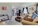 Bright living room with hardwood floors, cozy seating, and an open floor plan at 4415 N Longworth Ave, Indianapolis, IN 46226
