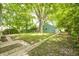 Backyard featuring grass, a mature tree and a view of the rear of the property at 4621 E 17Th St, Indianapolis, IN 46218