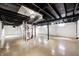 Unfinished basement with painted walls, exposed ceiling and concrete flooring at 4621 E 17Th St, Indianapolis, IN 46218