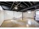 Unfinished basement with painted walls, exposed ceiling and concrete flooring at 4621 E 17Th St, Indianapolis, IN 46218
