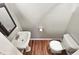 Small bathroom features a pedestal sink and a modern toilet at 4621 E 17Th St, Indianapolis, IN 46218