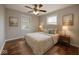 Cozy bedroom with neutral walls, wood floors, and comfortable, plush bedding at 4621 E 17Th St, Indianapolis, IN 46218