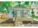 Charming bungalow with covered porch, beautiful landscaping, and freshly planted flower beds at 4621 E 17Th St, Indianapolis, IN 46218