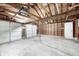 Spacious garage with multiple doors and high ceiling for ample storage and vehicle space at 4621 E 17Th St, Indianapolis, IN 46218