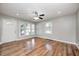 Spacious living room featuring hardwood floors, a ceiling fan and plenty of natural light at 4621 E 17Th St, Indianapolis, IN 46218