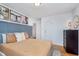 Cozy bedroom with hardwood floors, neutral colors and wood accents at 4641 Ralston Ave, Indianapolis, IN 46205
