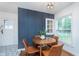 Charming dining area features a round table, stylish chairs, and unique wall decor at 4641 Ralston Ave, Indianapolis, IN 46205