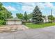 Charming home with a two-car garage, fenced yard, mature trees, and well-kept landscaping at 4641 Ralston Ave, Indianapolis, IN 46205