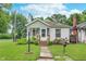 Charming cottage-style home with a landscaped front yard, a garden, and a welcoming entrance at 4641 Ralston Ave, Indianapolis, IN 46205