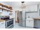 Bright kitchen featuring white cabinets and a stainless steel refrigerator at 4641 Ralston Ave, Indianapolis, IN 46205