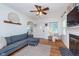 Cozy living room with a gray sofa, hardwood floors, and a decorative fireplace at 4641 Ralston Ave, Indianapolis, IN 46205