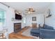 Inviting living room with a fireplace, hardwood floors, and comfortable seating at 4641 Ralston Ave, Indianapolis, IN 46205