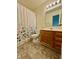Bathroom featuring a floral shower curtain, single vanity, and tile flooring at 509 Woodberry Dr, Danville, IN 46122