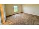 Neutral bedroom with a window and carpet flooring at 509 Woodberry Dr, Danville, IN 46122