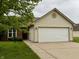 Well-maintained home with a two-car attached garage and nicely kept front lawn at 509 Woodberry Dr, Danville, IN 46122