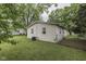 Yard with mature trees provides pleasant shade and a private, secure outdoor space at 521 Elmhurst Pl, Whiteland, IN 46184