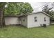 View of back exterior featuring vinyl siding and level, well-manicured yard space at 521 Elmhurst Pl, Whiteland, IN 46184