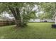 Spacious backyard featuring a large tree and well-maintained lawn at 521 Elmhurst Pl, Whiteland, IN 46184