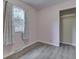 This cozy bedroom includes wood-look floors and a closet for easy storage and organization at 521 Elmhurst Pl, Whiteland, IN 46184