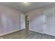 This bedroom offers modern flooring, neutral paint, and multiple closets for ample storage at 521 Elmhurst Pl, Whiteland, IN 46184