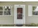 Close up of a front door with sidelight windows and vinyl siding at 521 Elmhurst Pl, Whiteland, IN 46184