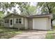 Single-story home featuring neutral siding, a one-car garage, and a simple, cozy design at 521 Elmhurst Pl, Whiteland, IN 46184
