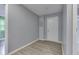 Hallway with hardwood floors that connects to the laundry room at 521 Elmhurst Pl, Whiteland, IN 46184