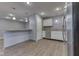 Kitchen with stainless steel appliances, white cabinets, and a kitchen bar at 521 Elmhurst Pl, Whiteland, IN 46184