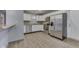 Bright kitchen with stainless steel appliances and white cabinets at 521 Elmhurst Pl, Whiteland, IN 46184