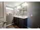 Bathroom featuring a double vanity and a large mirror at 5374 John Quincy Adams Ct, Plainfield, IN 46168