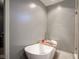 Elegant bathroom features a standalone soaking tub and modern fixtures, creating a spa-like atmosphere at 5374 John Quincy Adams Ct, Plainfield, IN 46168