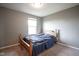 Simple bedroom with neutral walls, cozy carpet, and a bed with a solid wooden frame at 5374 John Quincy Adams Ct, Plainfield, IN 46168