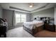 Comfortable bedroom featuring a large window for natural light and a bed with storage drawers at 5374 John Quincy Adams Ct, Plainfield, IN 46168