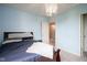 Cozy bedroom with blue walls and neutral carpet at 5374 John Quincy Adams Ct, Plainfield, IN 46168