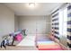 Bright bonus room with gymnastics equipment, a balance beam, and striped curtains at 5374 John Quincy Adams Ct, Plainfield, IN 46168